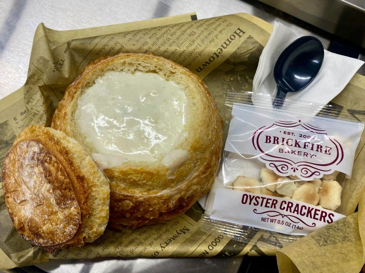 Creamy soup served in a fresh-baked bread bowl with oyster crackers.